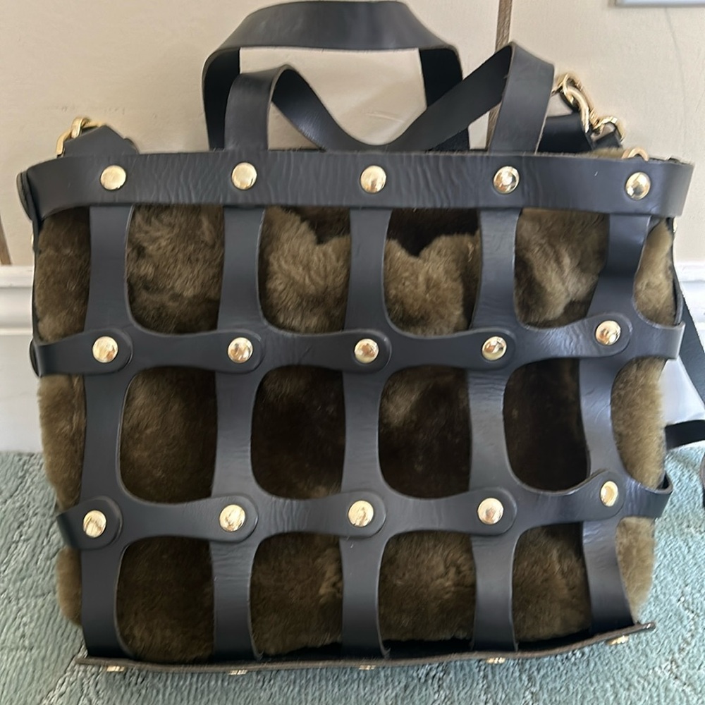 Cuir rose black leather studded cage bag with olive shearling drawstring insert